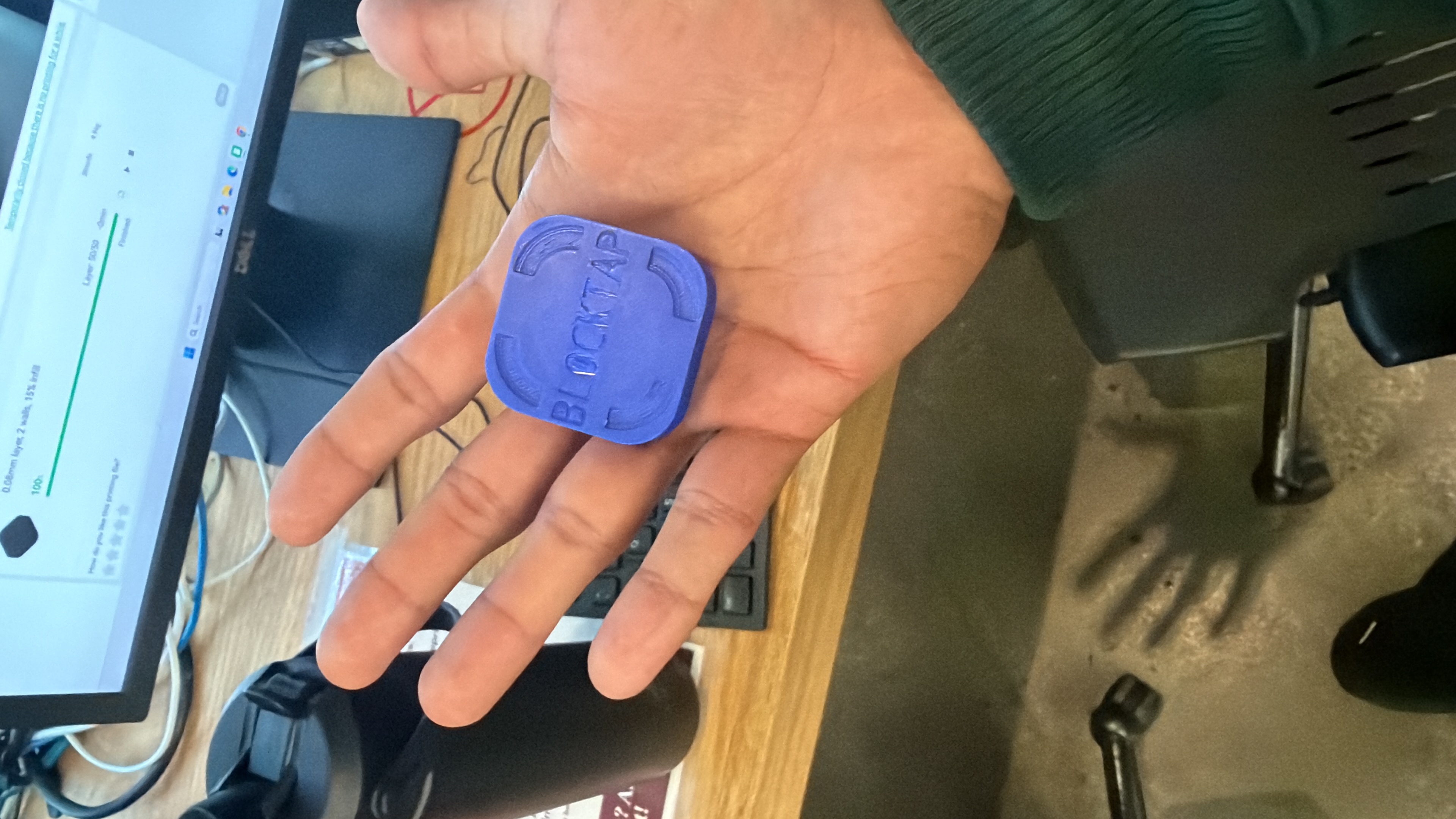 The original violet Blocktap prototype held in a hand